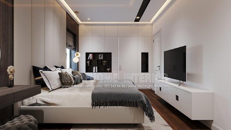 Kệ tivi gỗ công nghiệp sơn trắng với tay nắm âm độc đáo sẽ làm nổi bật vẻ đẹp sang trọng của phòng ngủ hiện đại.